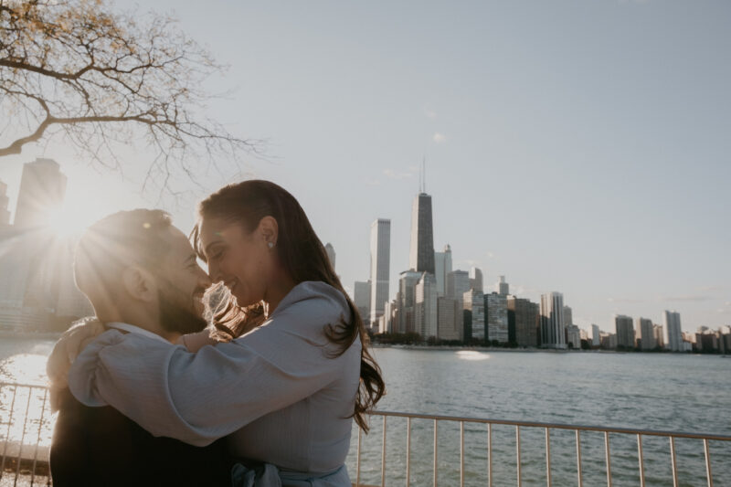 A man and woman hugging and smiling.